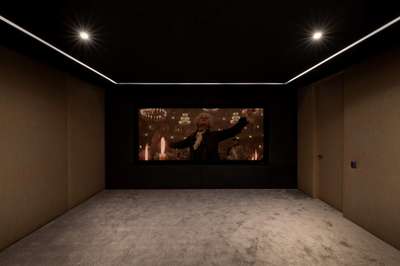 Private soundproofed home cinema room with plush carpeting for exclusive movie screenings at Zezere Ascent, Quinta do Lago.