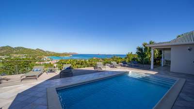 Breathtaking ocean views from the private pool and wooden sun deck at Acajous Estate, a luxury villa rental in St. Jean.