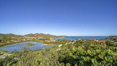 Stunning St. Jean bay and ocean vistas from the luxurious Acajous Estate, offering an elevated Caribbean escape in St. Barths.