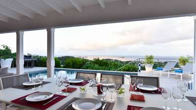 Memorable alfresco dining on the grand terrace, featuring a gas barbecue, heated pool, and stunning St. Barths ocean vistas.