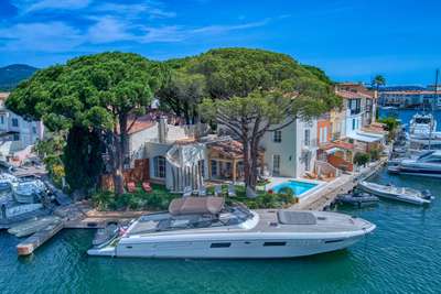 Luxury waterfront villa in Port Grimaud with a private pool, lush garden, and exclusive boat mooring on the French Riviera.