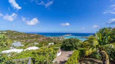 Breathtaking panoramic views of the azure Grand-Cul-de-Sac lagoon and lush tropical landscape from luxury Villa Bibi.