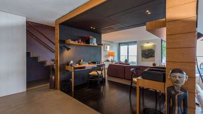 Sophisticated dedicated office area at Casa Tigre with dark wood floors, modern desk, and serene ocean views.