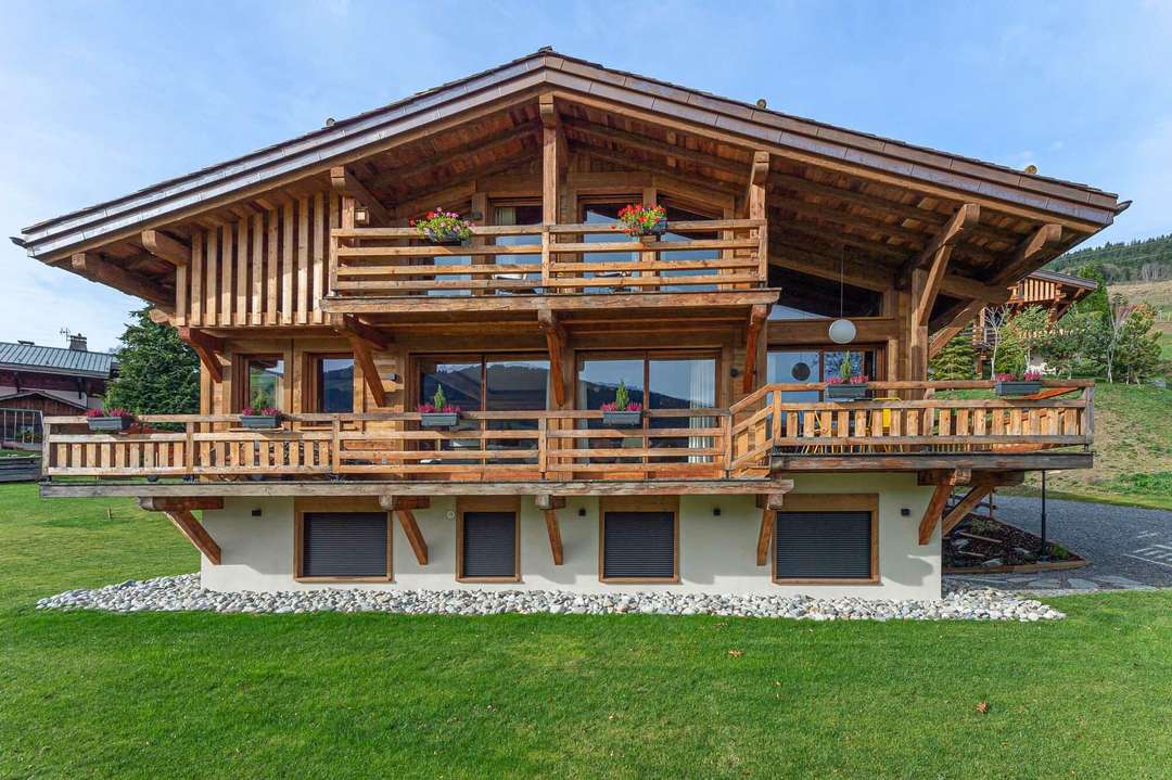 Chalet Paradis exterior featuring classic wooden architecture, expansive balconies, and stunning alpine views in Megève.