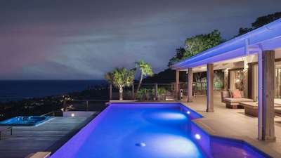 Breathtaking night ocean views from the heated infinity pool and secluded wooden deck jacuzzi at this luxury Toiny villa.