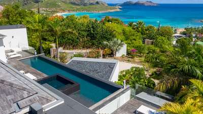 Breathtaking ocean views over St. Jean bay from the sleek heated infinity pool and jacuzzi of this high-end luxury villa.