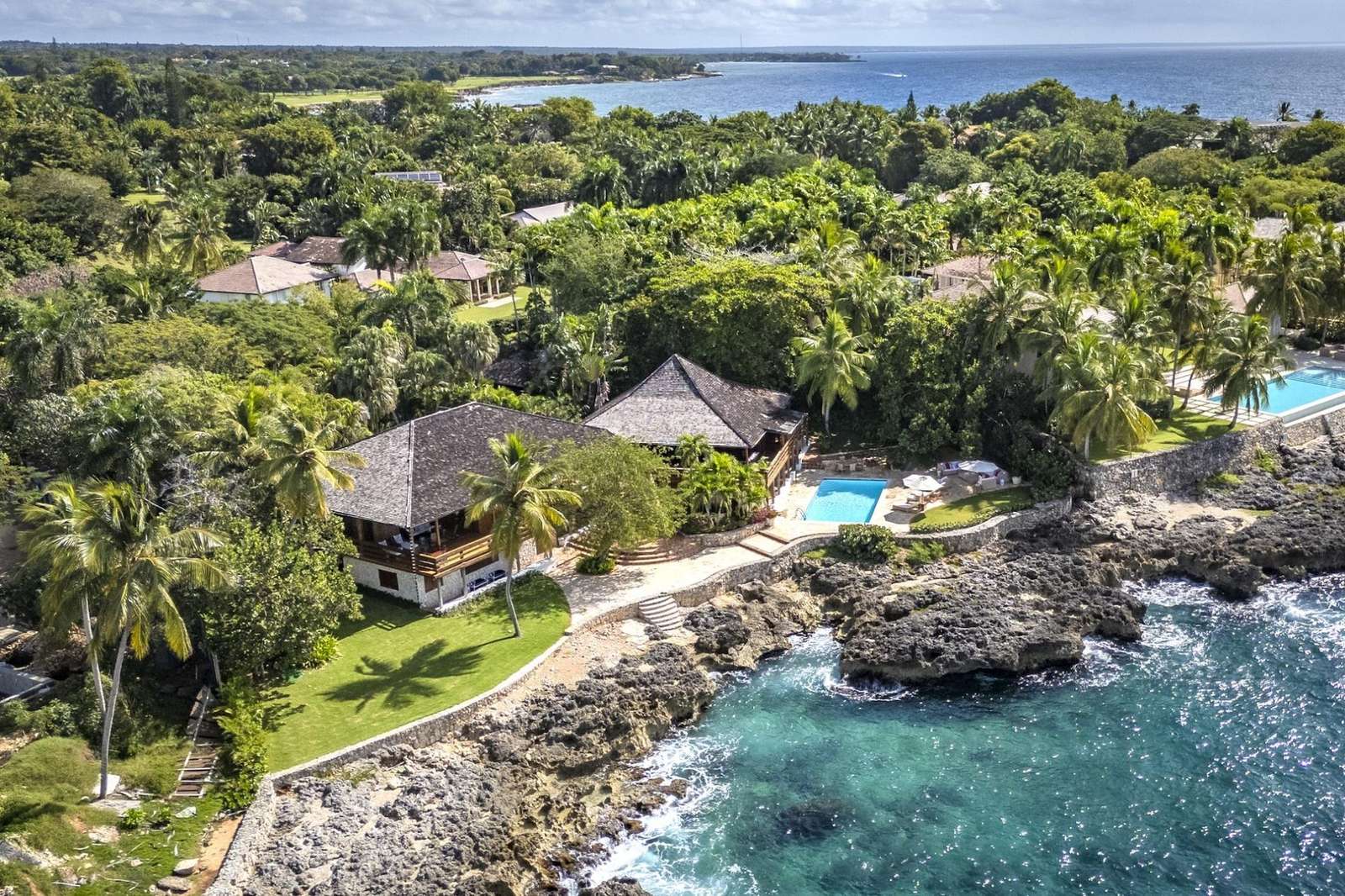 La Madera, Casa de Campo – Aerial view of La Madera's natural wood architecture, private pool, and breathtaking Caribbean Sea views in Casa de Campo.