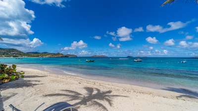 Pristine white sands and turquoise Caribbean waters at Lorient beach, steps away from the luxurious Villa La Plage estate.