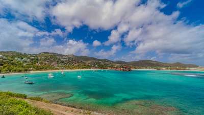 Sweeping panoramic ocean views of St. Jean Bay's turquoise waters from Reef Point, showcasing St. Barth's natural beauty.