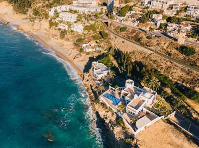 Aerial view of Stone Whisper in Villajoyosa, highlighting the private pool, white architecture, and stunning waterfront.