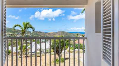 Majestic panoramic views of rolling hills and the distant ocean from the private bedroom terrace at Villa Supersky.