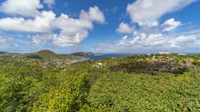 Spectacular panoramic ocean and distant island views from the elevated verdant heights of luxury Villa Ti Agave in Vitet.