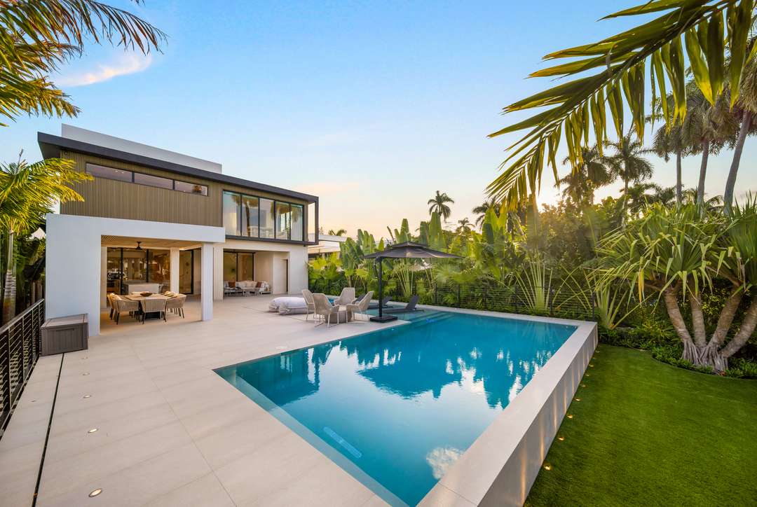 Modern luxury Villa Leblon exterior with private pool, elegant outdoor lounge, and lush tropical gardens in Belle Meade.
