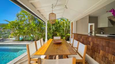 Host elegant meals at the al fresco dining area of Villa Xanadu, overlooking the private swimming pool and lush tropical gardens.